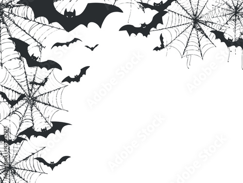 A spooky Halloween background with black bats and spiderwebs creating an eerie atmosphere.