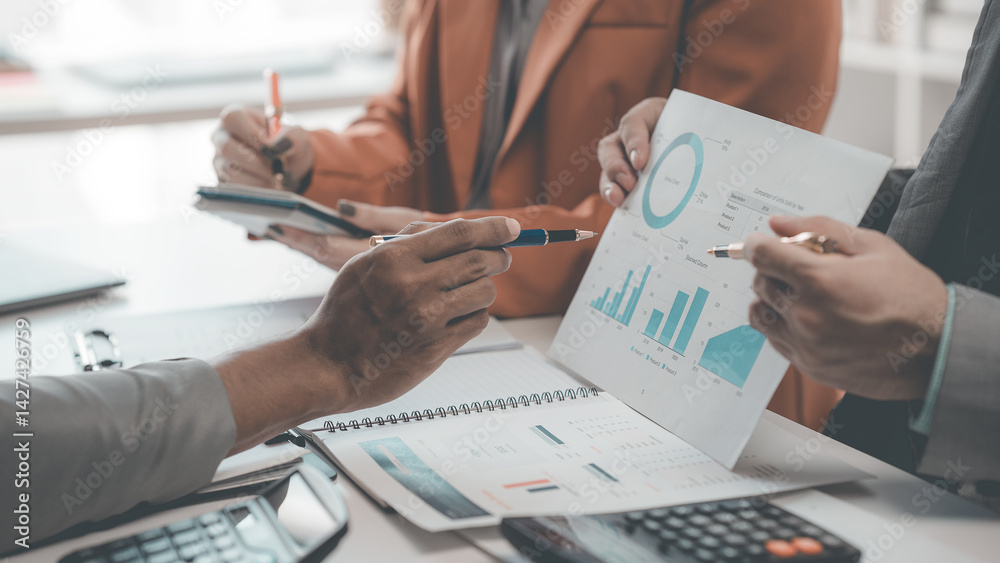 Business people are talking about charts and graphs showing the results of successful teamwork. Business growth showing the results of teamwork.
Business people are talking about charts and graphs showing the results of successful teamwork. Business growth showing the results of teamwork.