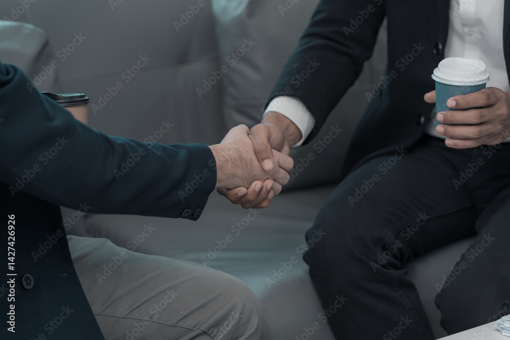Concept of business negotiation and handshake to show connection between people in making deal with close up photo of business partners shaking hands.