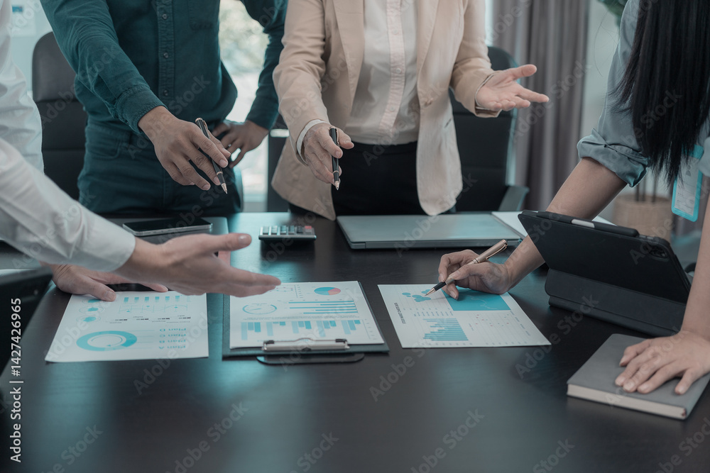 Business people are talking about charts and graphs showing the results of successful teamwork. Business growth showing the results of teamwork.