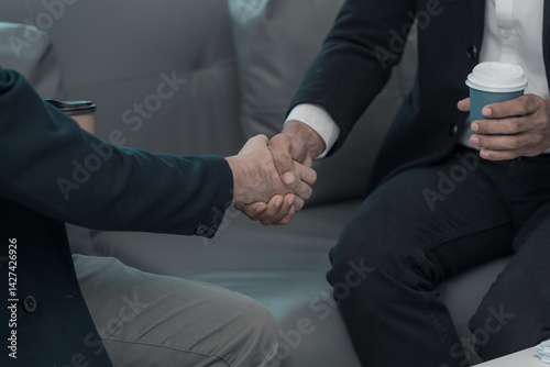 Obraz na płótnie Concept of business negotiation and handshake to show connection between people in making deal with close up photo of business partners shaking hands. w salonie