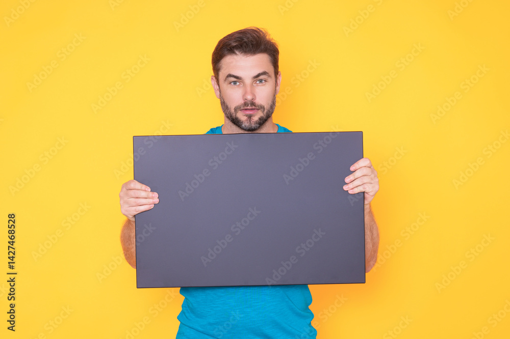 Man with empty blank board on studio background. Blank signboard with copy space. Advertisement concept. Ad board with copy space, blank mock up copy space. Blank signboard, placard with copy space. Man with empty blank board on studio background. Blank signboard with copy space. Advertisement concept. Ad board with copy space, blank mock up copy space. Blank signboard, placard with copy space.