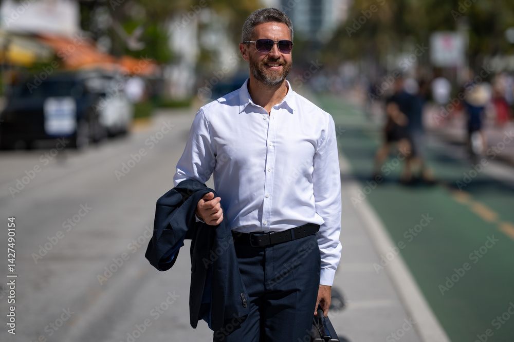 Business man walk to work. Hispanic business man walking on the street confidently. Office worker on way to office. Mature business man walking on city. Business man in shirt walking outdoors.