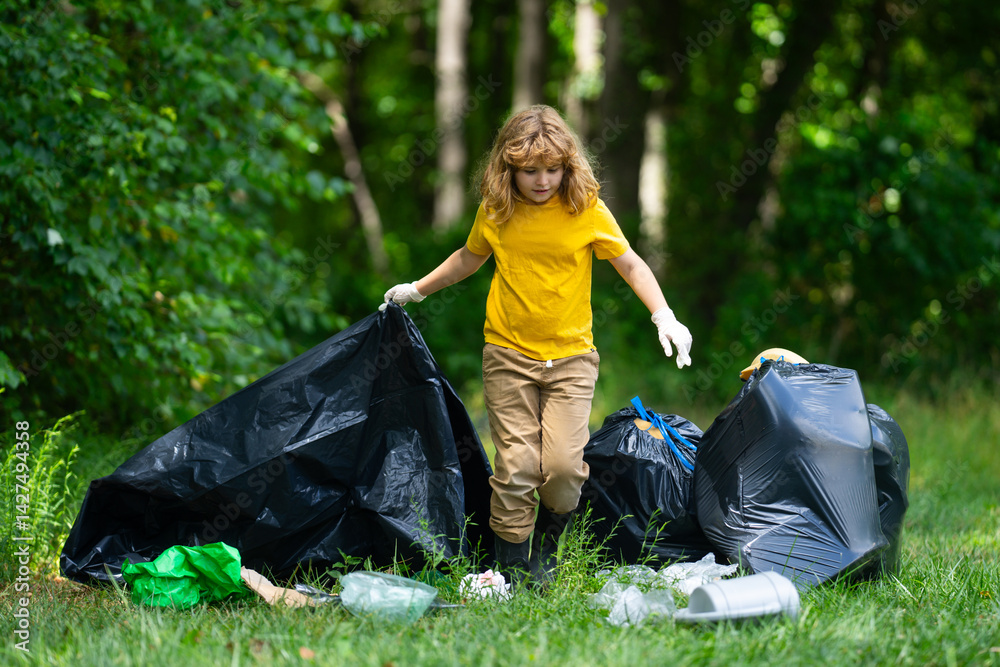 Child picking plastic trash for cleaning the nature. kid Clean up garbage outdoor. Ecology concept. Environment Day. Save earth. Recycling bin garbage. Ecology. Environmental care. Eco kid.