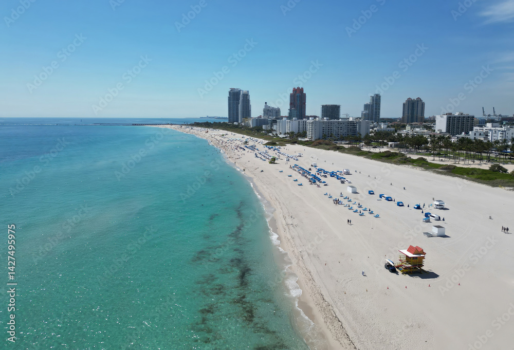 Miami Beach aerial drone view with skyline. Miami from above. Drone view of Miamis famous landmarks. South Pointe beach with skyscrapers. Miami city panorama. Oceanfront skyline of Miami Beach.