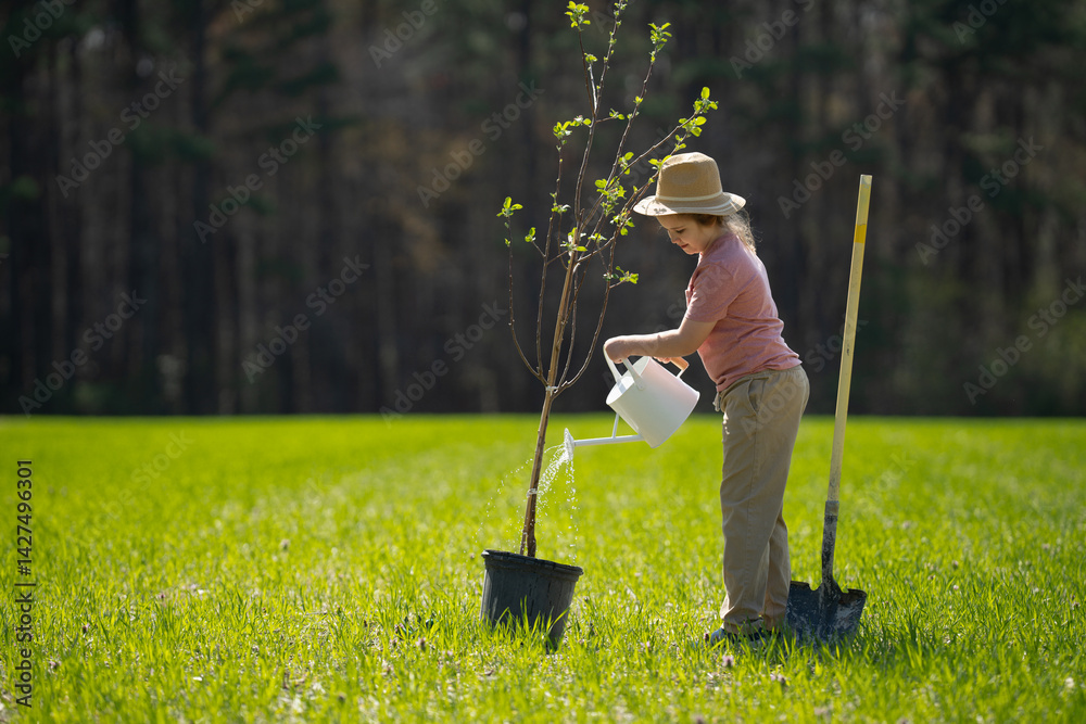 Kid gardening. Child cultivating a tree in garden. Child planting tree. Little gardener working with shovel. Spring gardening with kids. Child watering plants in garden. Child taking care of garden.