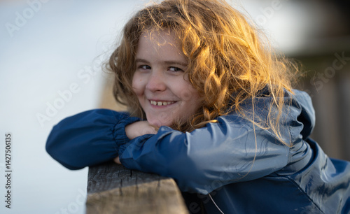 Obraz na płótnie Dreamy child enjoying fresh air. Portrait of a carefree child. Blonde child in imagination. Peaceful kid relaxing in nature. Child thinking about future. Cute little dreamer portrait. Kids face. w salonie
