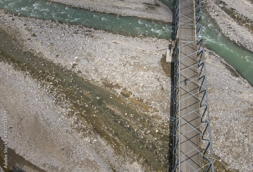 Aerial view of the construction of a bridge over a river crossing in Hatu Bulico Village, Ainaro Municipality, Timor Leste. The development of transportation access is still very much needed in Timor