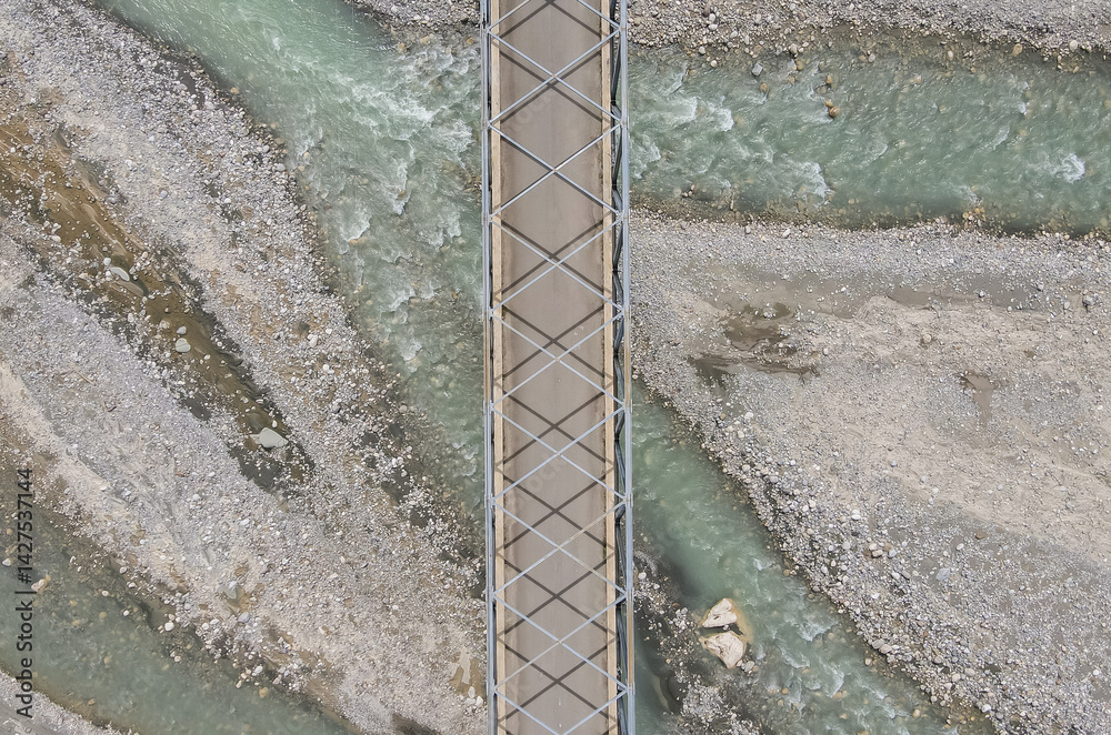 Aerial view of the construction of a bridge over a river crossing in Hatu Bulico Village, Ainaro Municipality, Timor Leste. The development of transportation access is still very much needed in Timor
