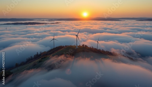 Majestic Sunrise Over Wind Turbines Surrounded by Rolling Fog and Scenic Hills in a Serene Landscape