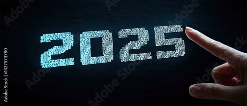 Obraz na płótnie A hand points at the digital display of the year 2025, showcasing a futuristic aesthetic with a dark background. Business Strategy, Customer Focus concept w salonie