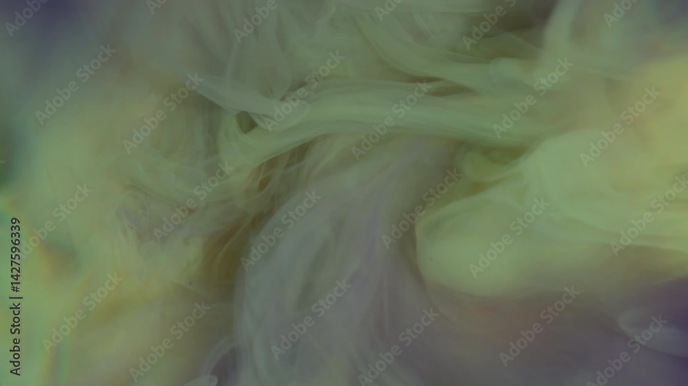 Ink cloud. Color splash. Pastel yellow dye drop dissolves in purple water. Liquid art streams shoot smoky on abstract defocused background.