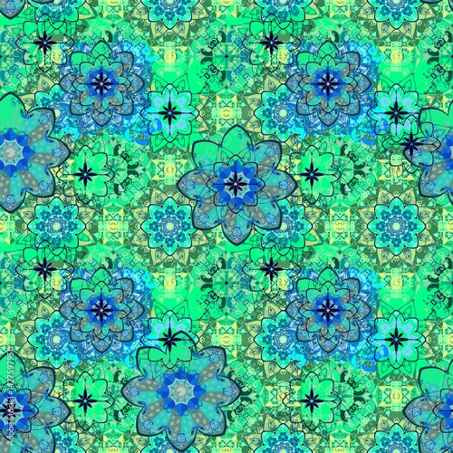 Multilayer floral pattern in blue and green tones. Seamless pattern with mandalas in ethnic style. Print for fabric.