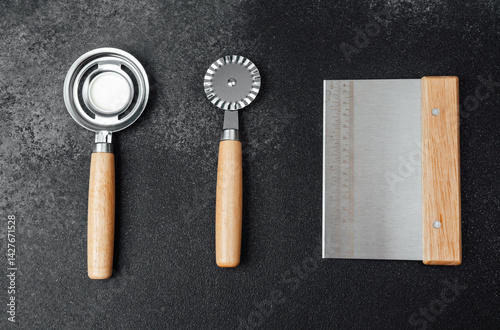 Obraz na płótnie Kitchen tools for baking and food preparation on a dark countertop w salonie