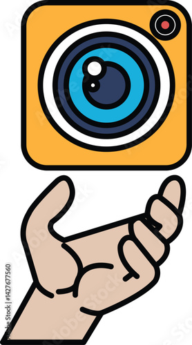 A hand holding a camera lens