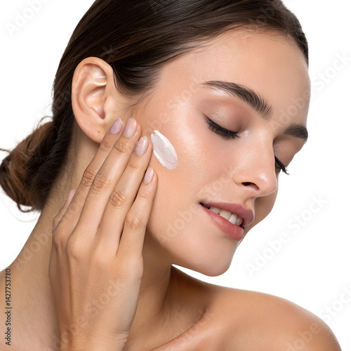 Young Woman Moisturizing Her Face with Skincare Product