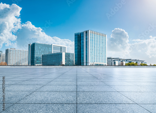 Fototapeta Naklejka Na Ścianę i Meble -  Empty square floor with modern cityscape and office buildings background