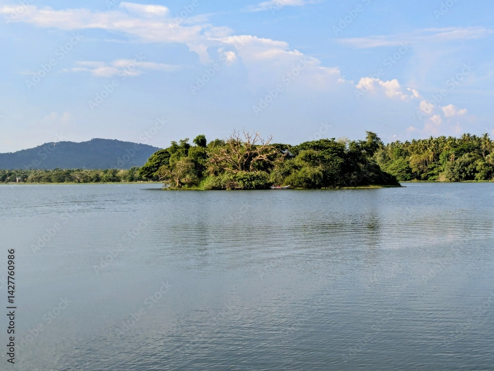 Fototapeta premium Serene Lake with a Green Island
