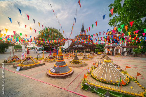 Obraz na płótnie PHITSANULOK, THAILAND - April 10,2025: Thai people come to build the Sand Pagoda for return the sand to the temple on Songkran festival at Ratchaburana temple in Phitsanulok Thailand. w salonie