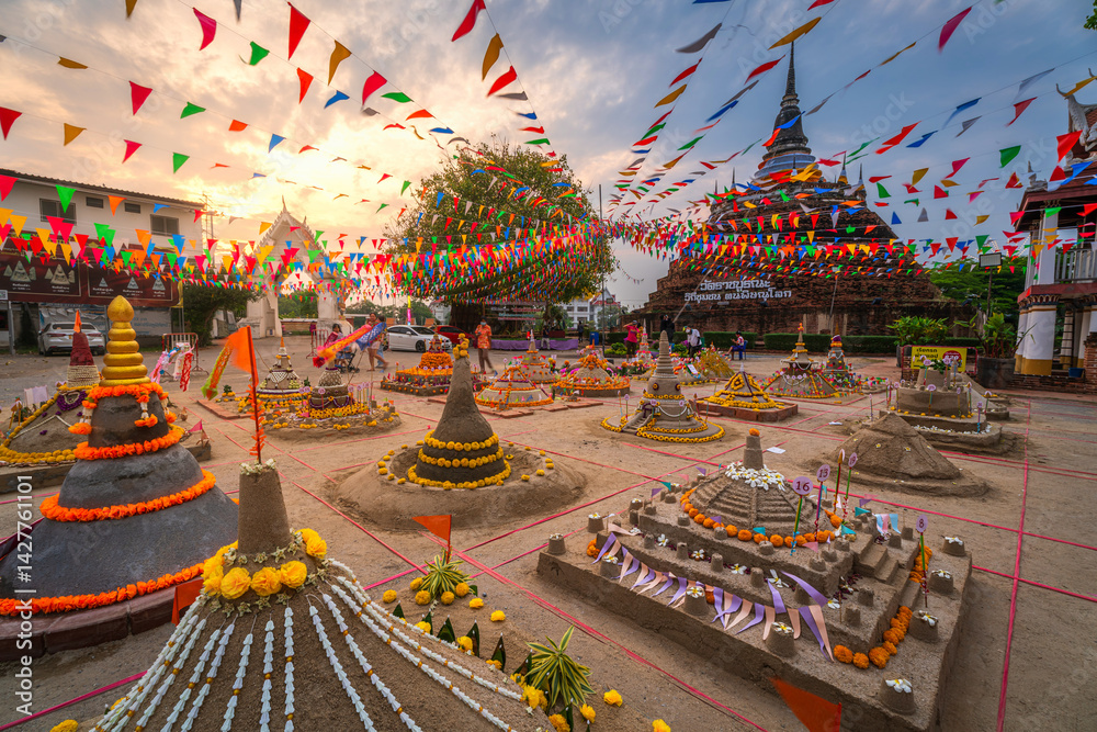 PHITSANULOK, THAILAND - April 10,2025: Thai people come to build the Sand Pagoda for return the sand to the temple on Songkran festival at Ratchaburana temple in Phitsanulok Thailand.