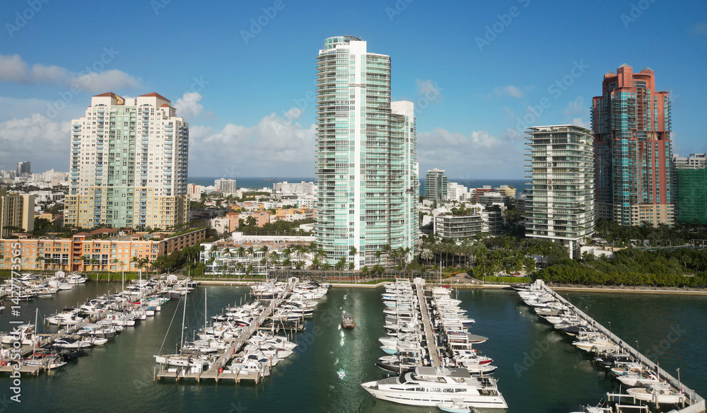 Fototapeta premium Marina dock. Luxury South beach marina. Miami south beach view. Docked luxurious yacht boat. Luxurious lifestyle. View of luxury Miami Florida. Summer vacation. Exclusive marina