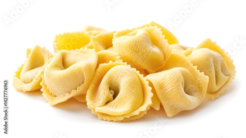 A delicious pile of uncooked tortellini pasta rests on a pristine white background ready for a culinary creation.