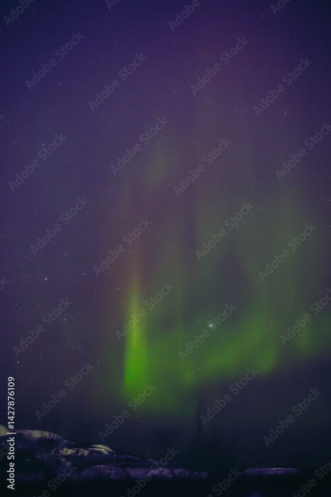 Aurora borealis, polar lights with Milky Way stars.