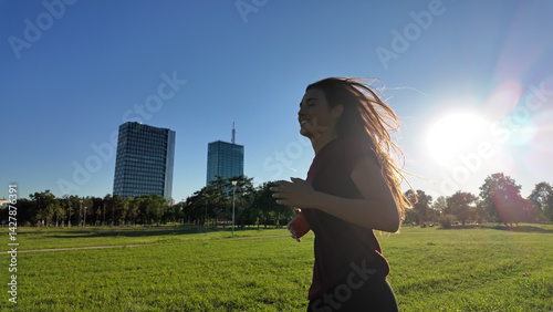 Obraz na płótnie Young woman running and jogging in urban park. w salonie