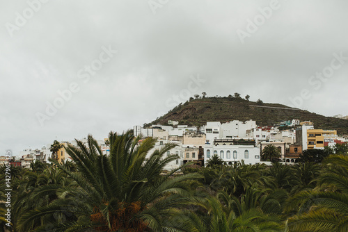 Scenic View of Town Against Mountainous Landscape