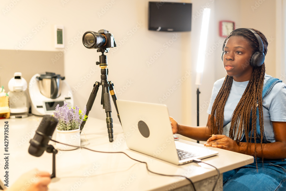 Teenager vlogger recording a video blog at home