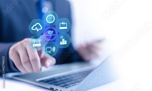 
IoT concept, Internet, Businessman pointing at digital icon, Smart Internet represents the Internet of Things (IoT), presenting modern technology and connectivity in a digital environment.