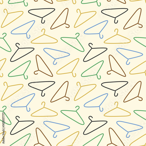 Colorful Hangers for Clothes on Pastel Yellow Seamless Pattern Design