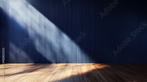 An empty room featuring blue walls and a warm wooden floor.
