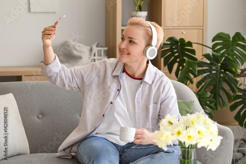 Young woman in headphones w...
