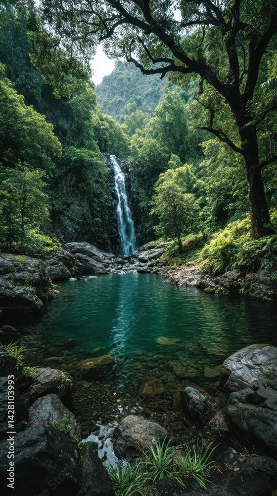 Naklejka premium Blue hour Tropical coastline concept. Lush waterfall cascading into a serene pool surrounded by dense greenery.
