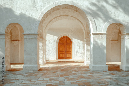 Obraz na płótnie White arched corridor with terracotta tiles and large wooden door. Mediterranean style entrance. Minimalist white stucco facade w salonie