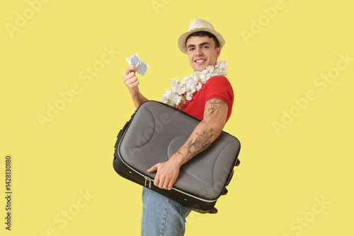 Young man with suitcase and...