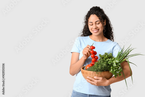 Smiling woman holding fresh...