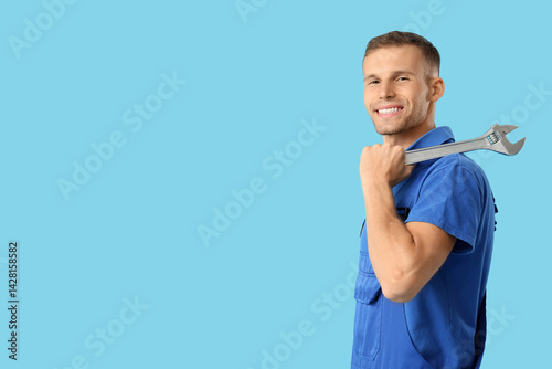 Male plumber with wrench on...