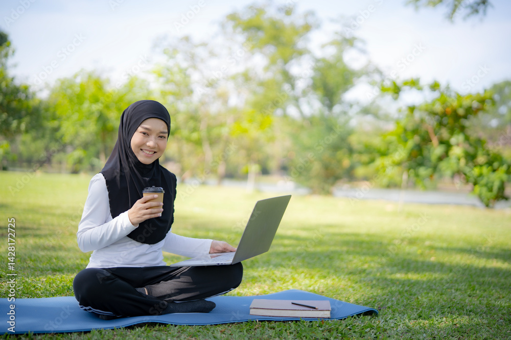 Serene scene of a Muslim woman studying or working on laptop in a park with a cup of coffee. Harmony, learning, and connection with the outdoors. Serene scene of a Muslim woman studying or working on laptop in a park with a cup of coffee. Harmony, learning, and connection with the outdoors.