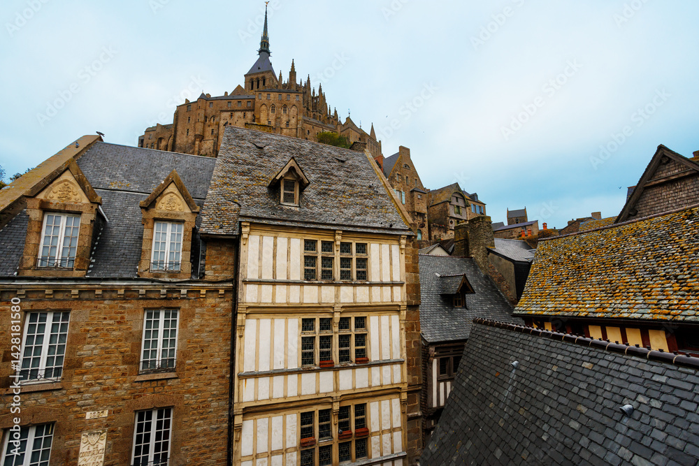 Majestic spire rises above ancient brick and stone buildings