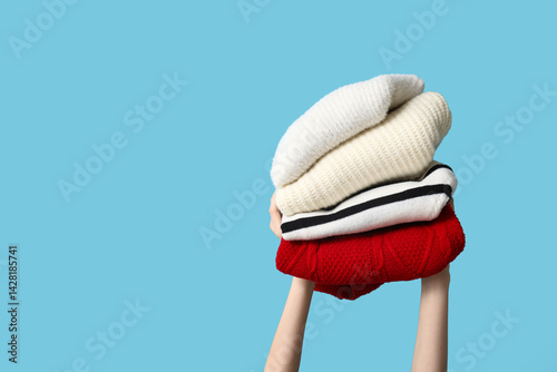 Hands holding stack of warm...