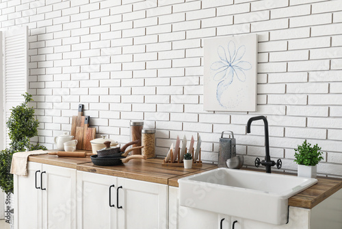 Sink, houseplants and utens...