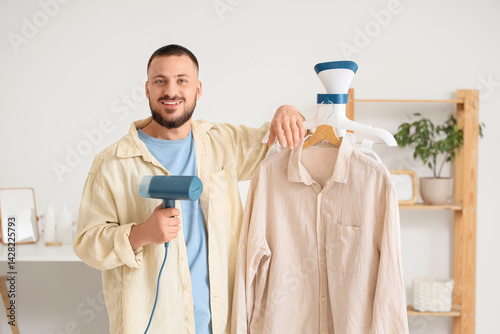 Young man with steamer and ...