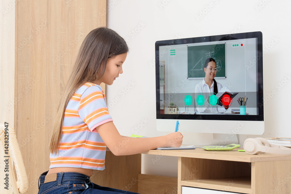Teenage girl studying Math with tutor online at table in room