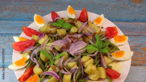 Fresh salad, green beans, small potatoes, egg, tomato, basil, red onions and balsamic vinaigrette. High quality video