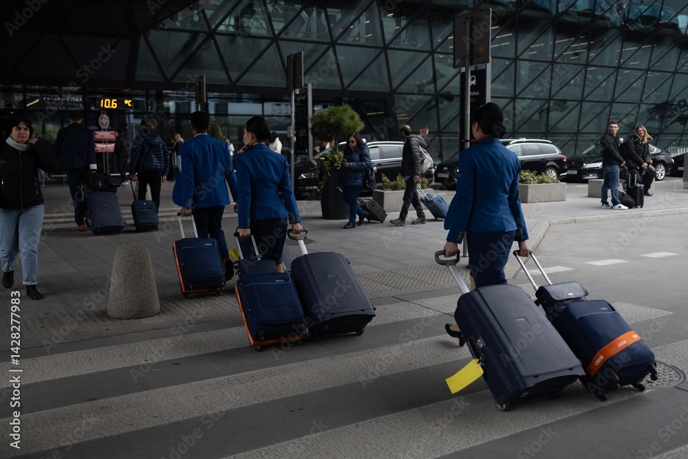 Silhouette of the tourists at airport carrying luggage. Travelers waiting flight at airport