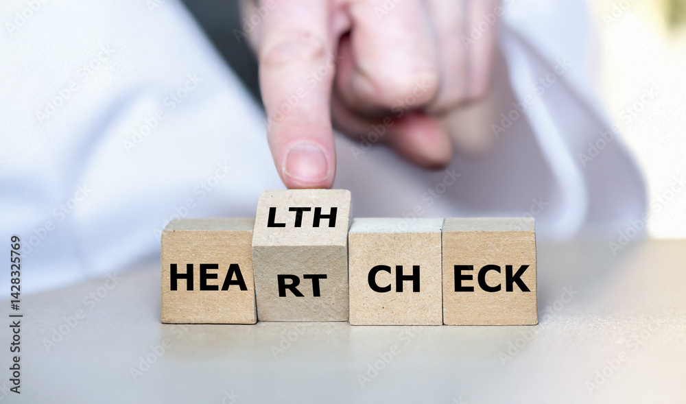 Naklejka premium Cubes form the expression 'heart check' and 'health check'.