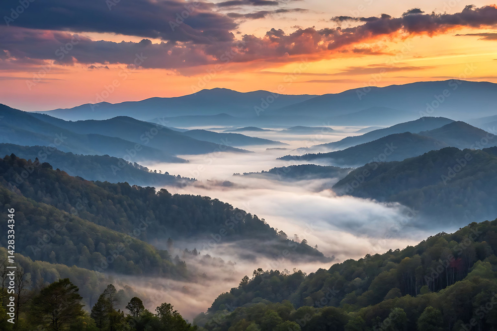 Obraz premium Misty Mountain Sunrise: A Breathtaking View of Fog-Shrouded Peaks