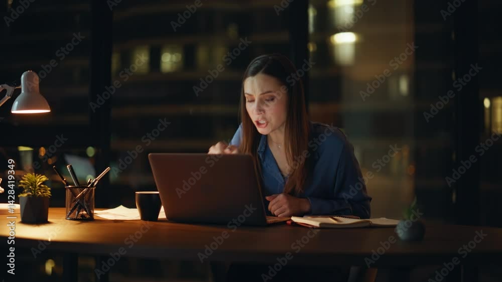 Woman boss arguing virtual conference showing papers to webcam at night office. Woman boss arguing virtual conference showing papers to webcam at night office.
